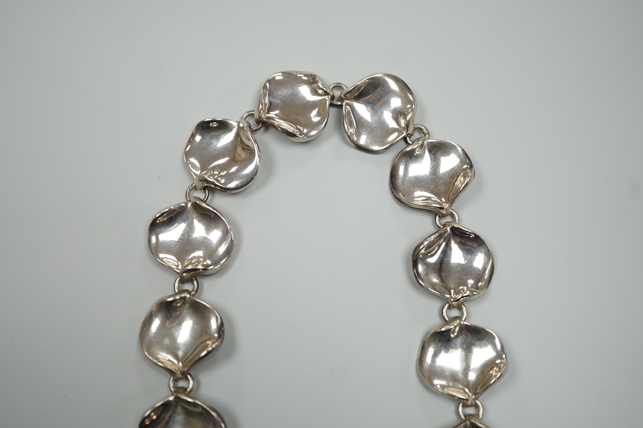 A modern Georg Jensen style silver necklace, with stylised petal links, maker AoL, London, 2008, 44cm, 189 grams.